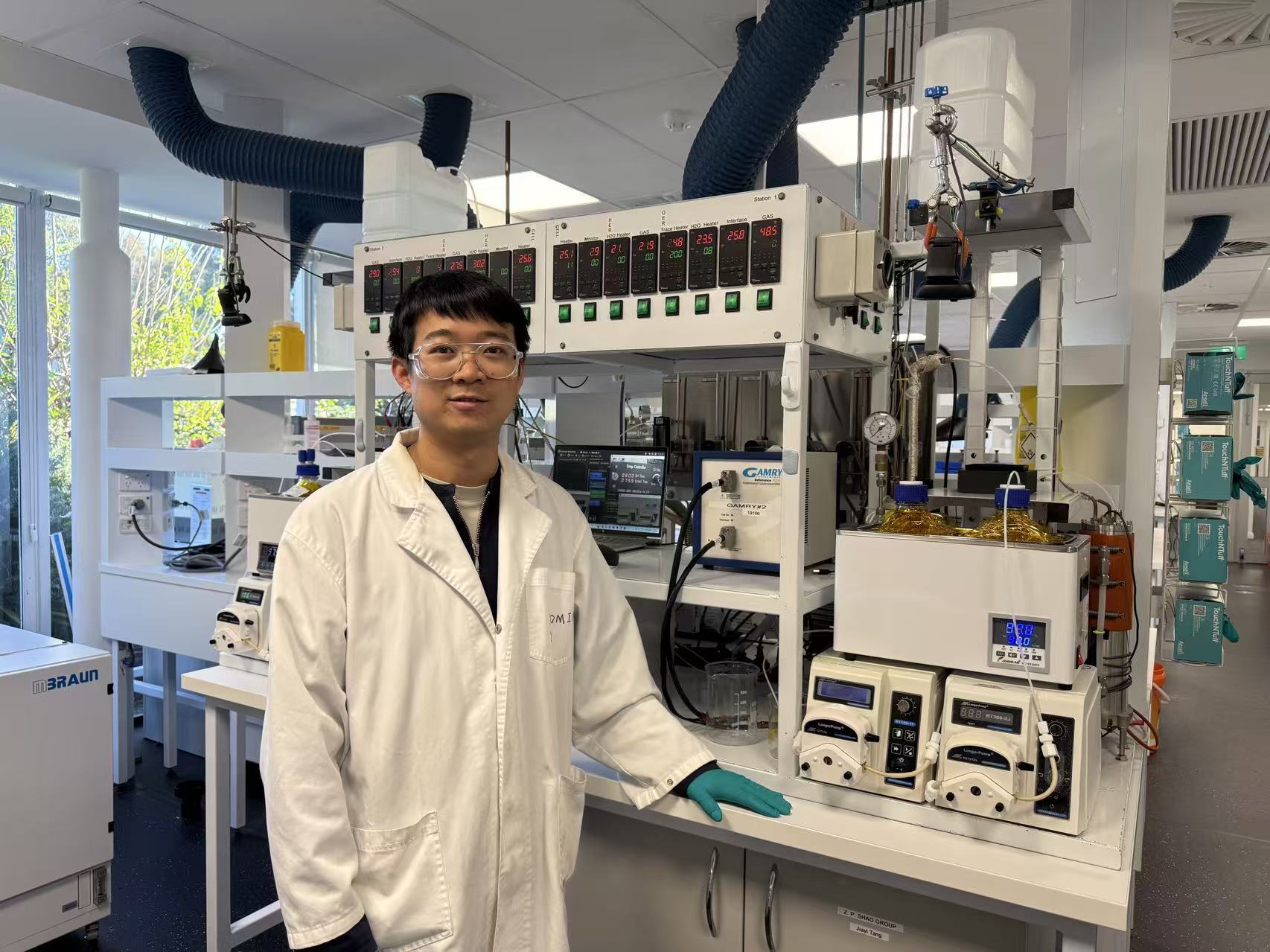 psa finalist xiaomin xu inside a lab wearing lab coat