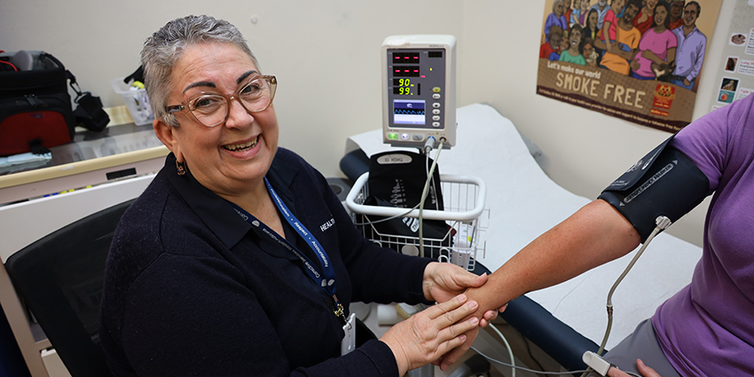 Nurse checking blood pressure