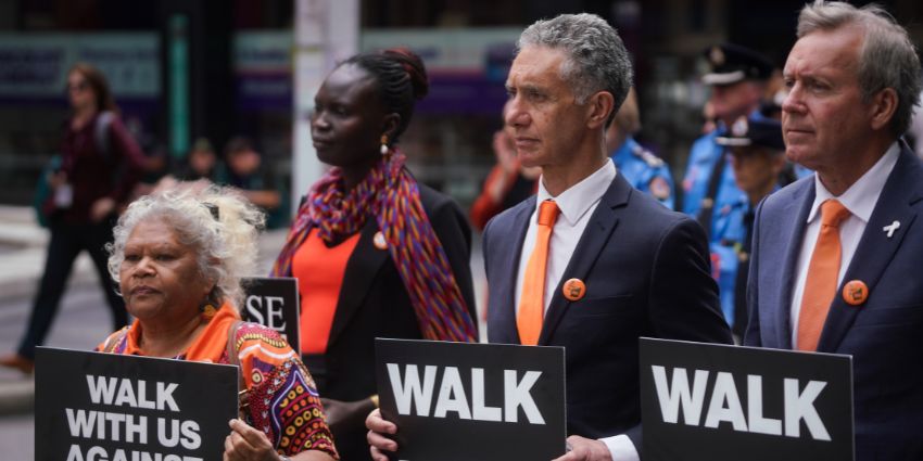 !6 Days March - Minister Toni Buti and Minister Witby holding signs at the March in Perth CBD