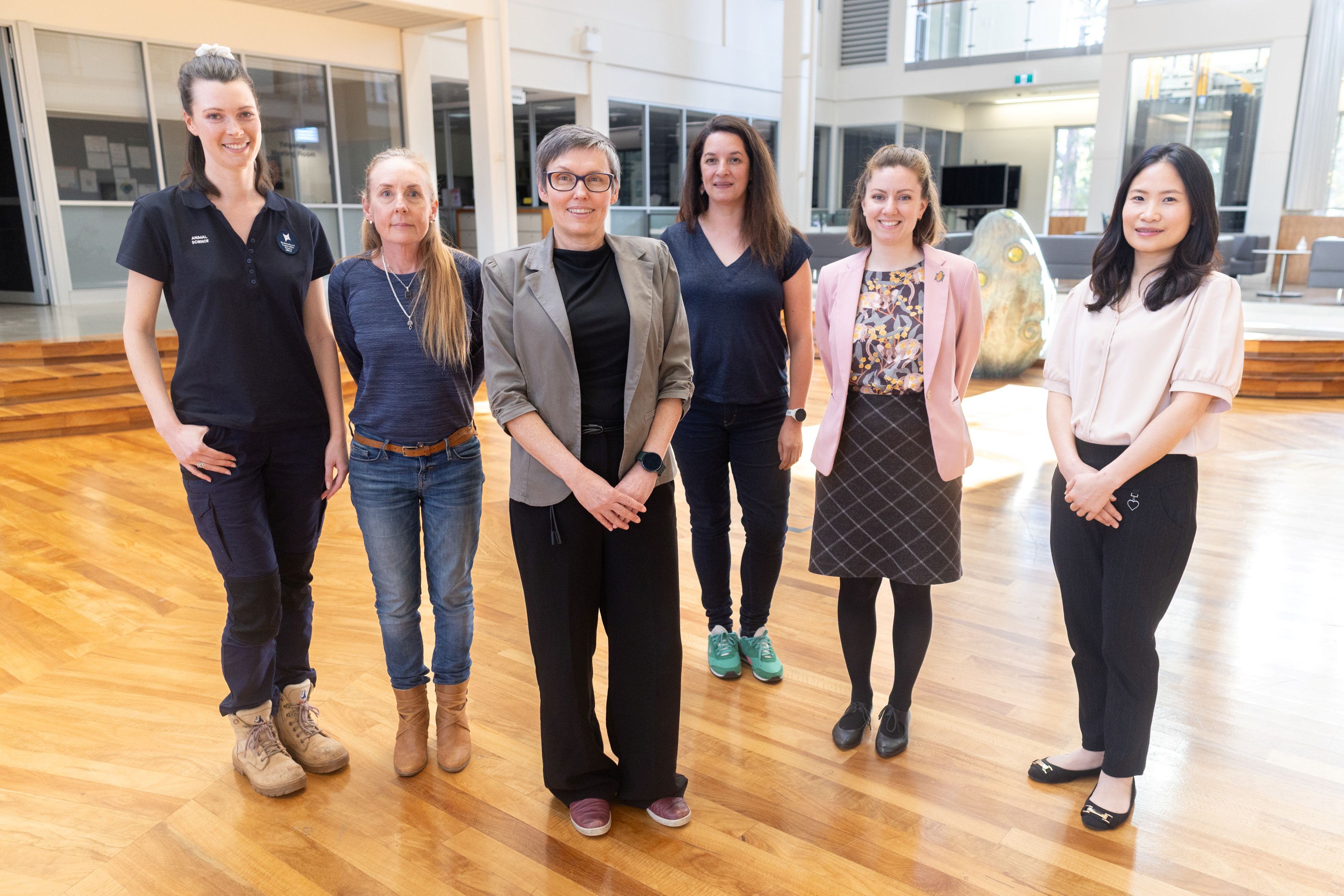 members of genetic assessment for conservation of rare and threated fauna project team standing in their office