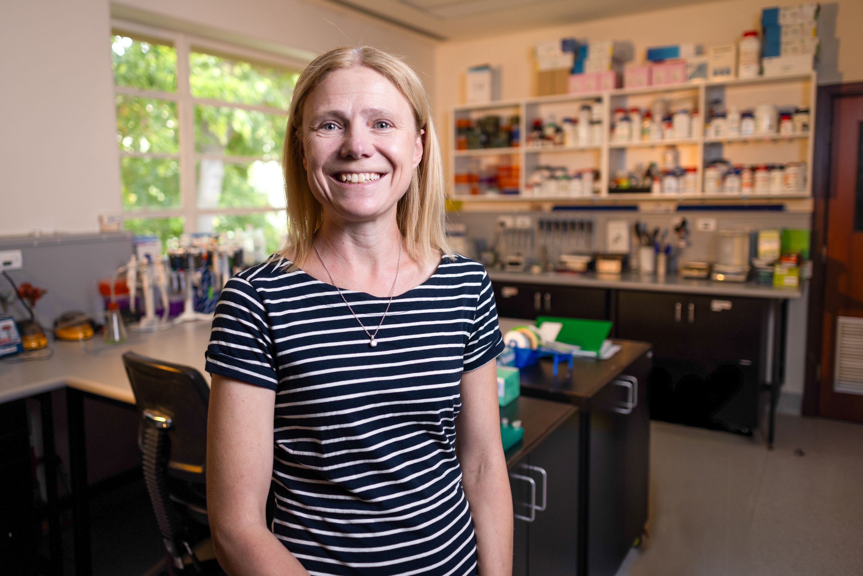 Jacqueline standing in her lab