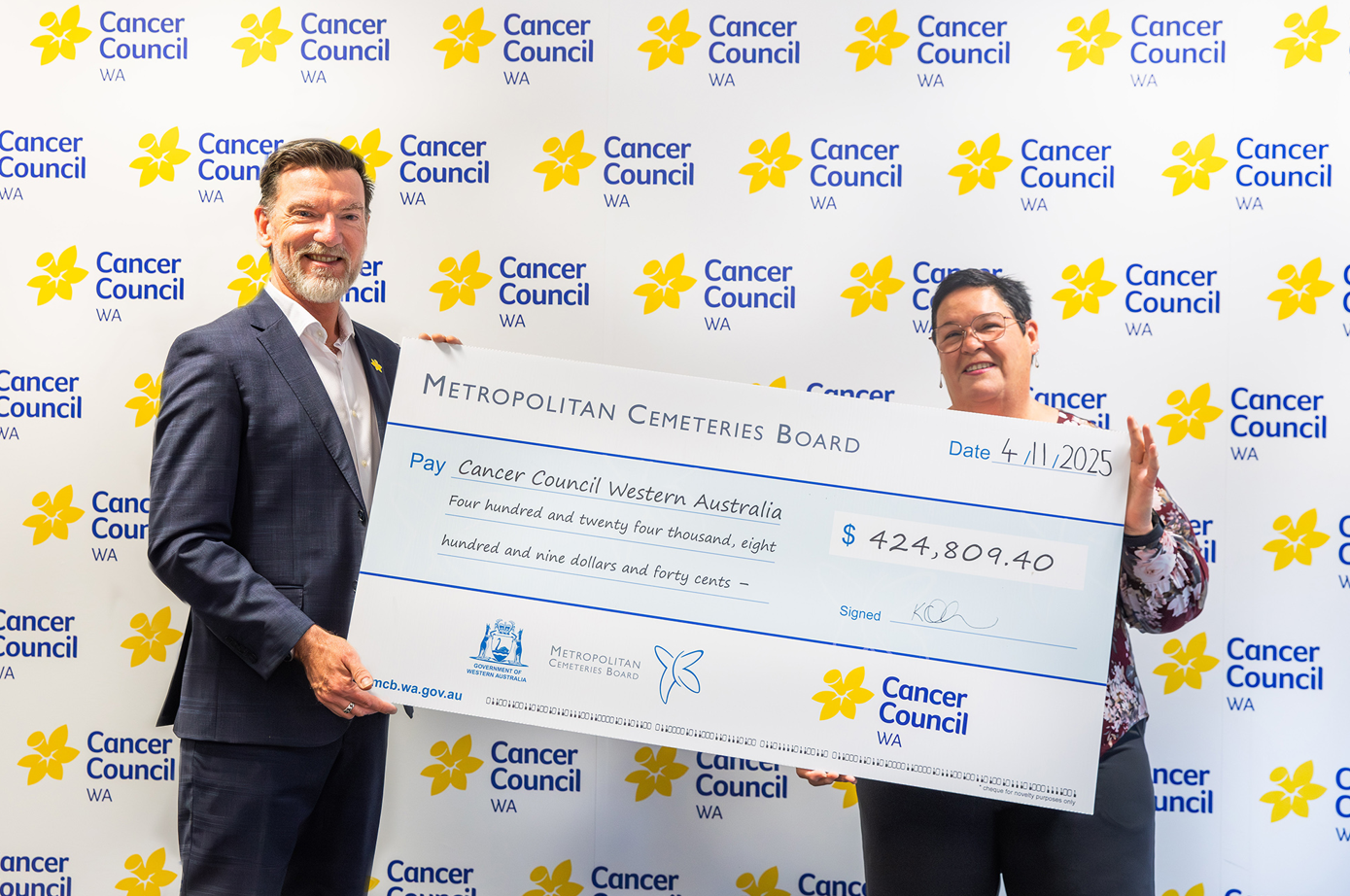 Metropolitan Cemeteries Board CEO hands over giant cheque to Cancer Council WA CEO