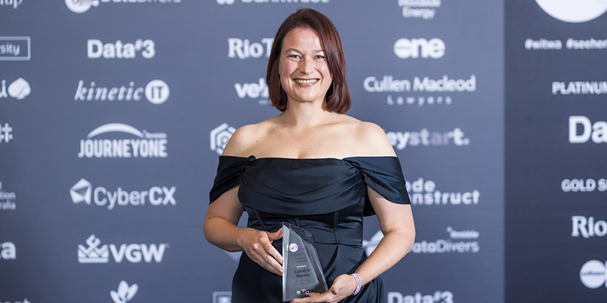 Carolyn Martin holding her trophy at the WITWA tech award