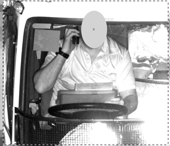 Driver using a laptop and mobile phone, while driving in a 100kmh speed zone