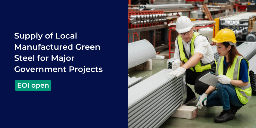 two workers wearing high vis vests and hard hats are crouched down looking at a stack of steel sheets
