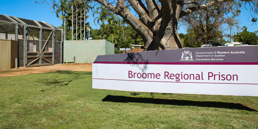 Photo of Broome Regional Prison facility from the outside showing signage