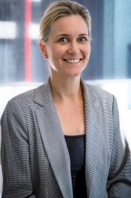 a woman, well dressed and smiling