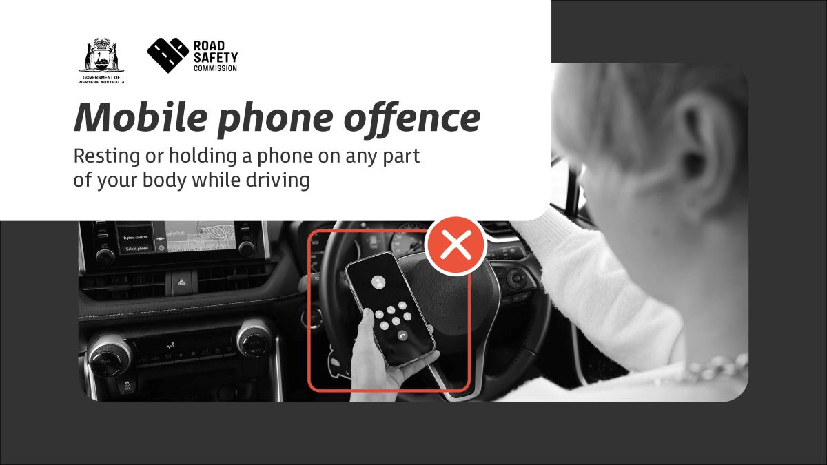 Example of mobile phone offence - holding and looking at phone while driving