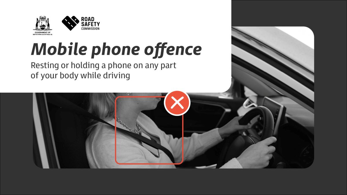 Example of mobile phone offence - phone tucked into chest sash while driving