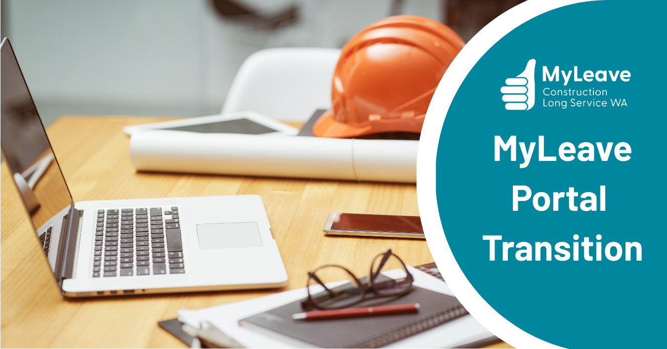 Laptop on construction desk, hard hat