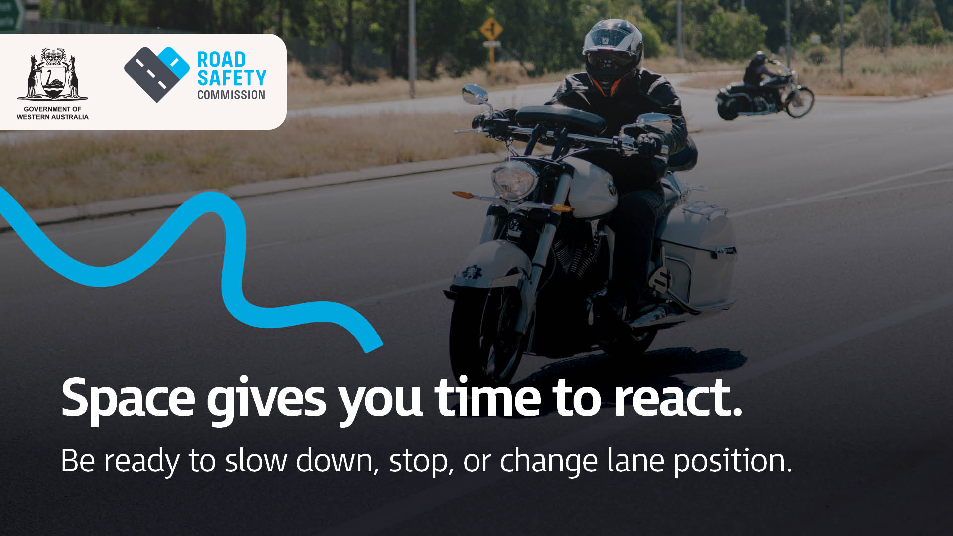 A motorcyclist in safety gear riding with two other motorcyclists in the background