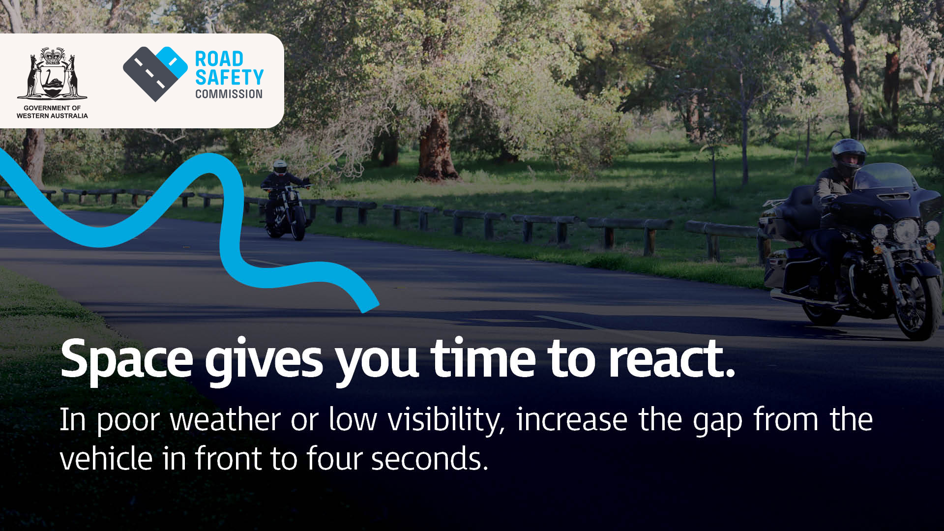 Motorcyclists riding next to a park with lots of space between them