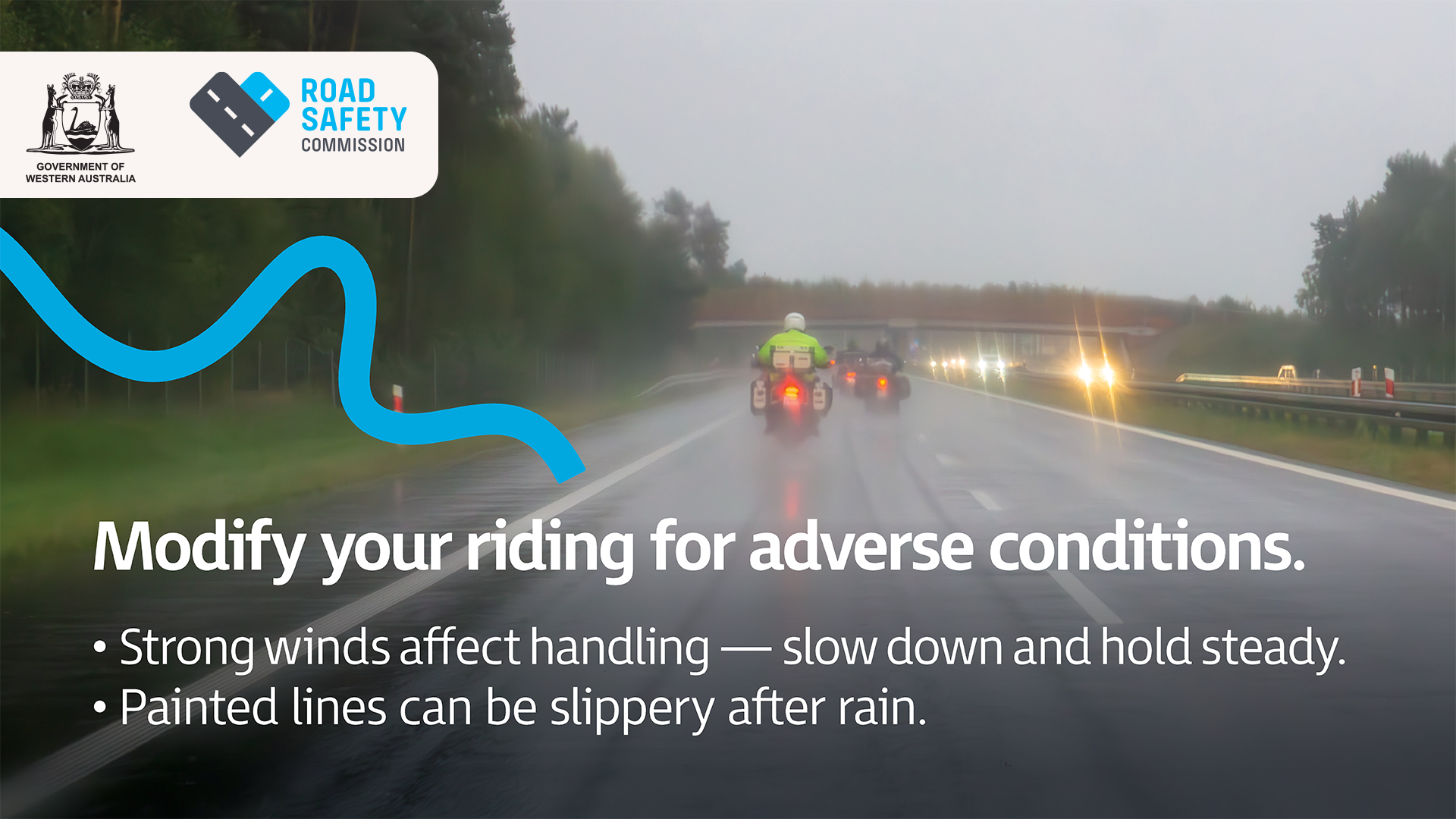 Two motorcycle riders riding in rainy conditions with the lights ahead blurred