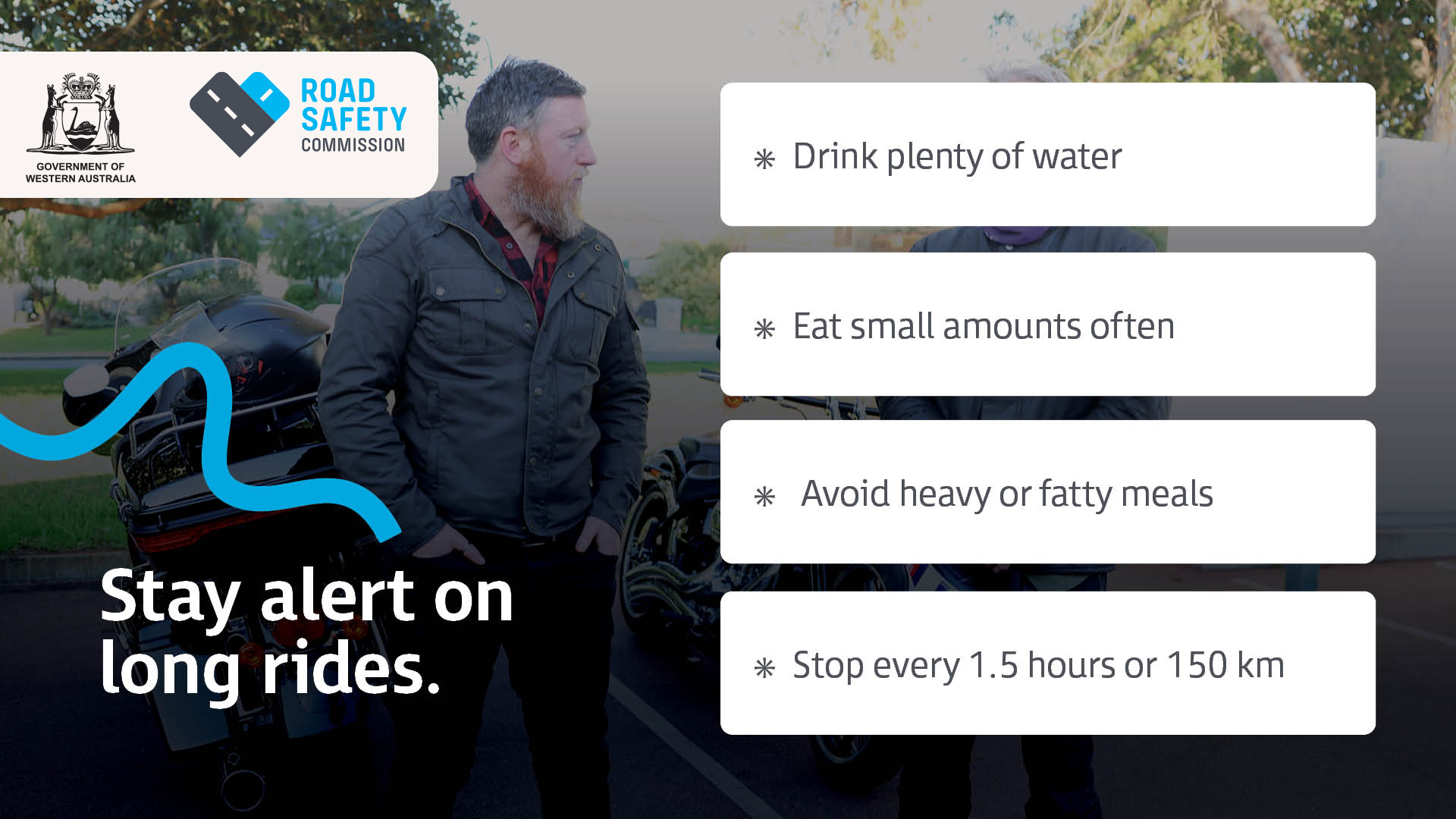 A motorcyclist is standing next to his bike, appears to be taking a riding break