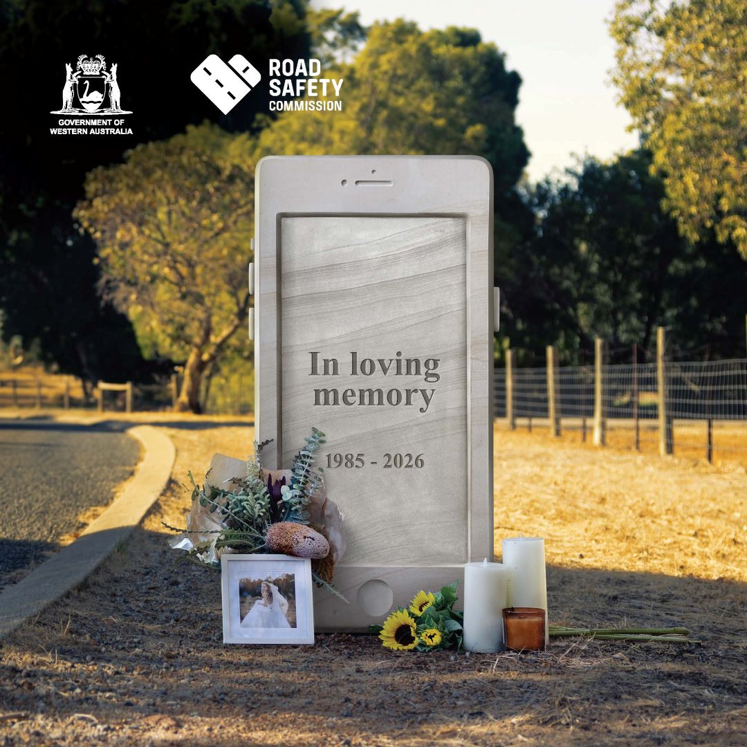 Headstone phone on side of road with text, 'In loving memory' showing a wife's belongings