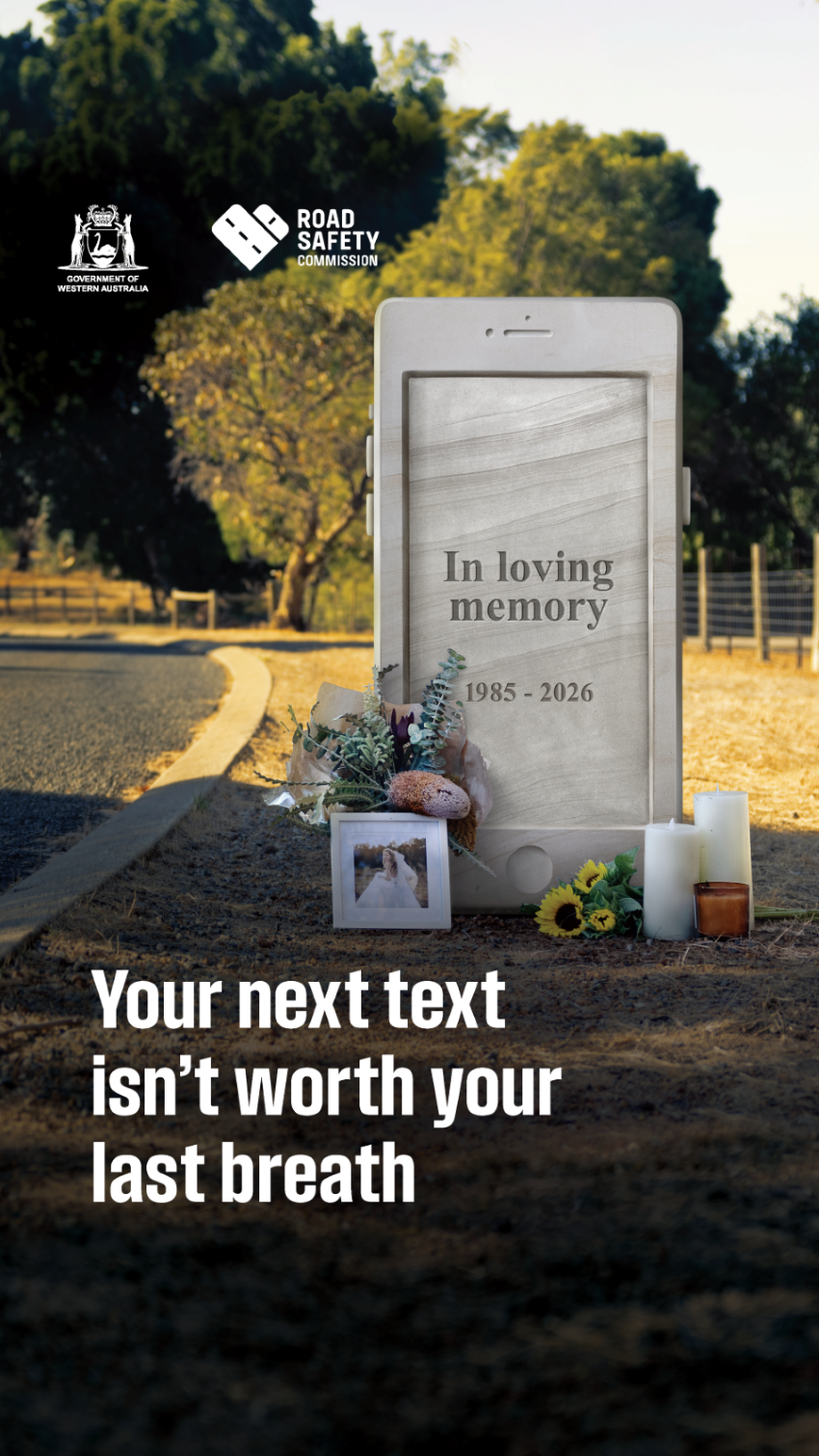 headstone phone on side of road with text, 'your next text isn't worth your last breath'