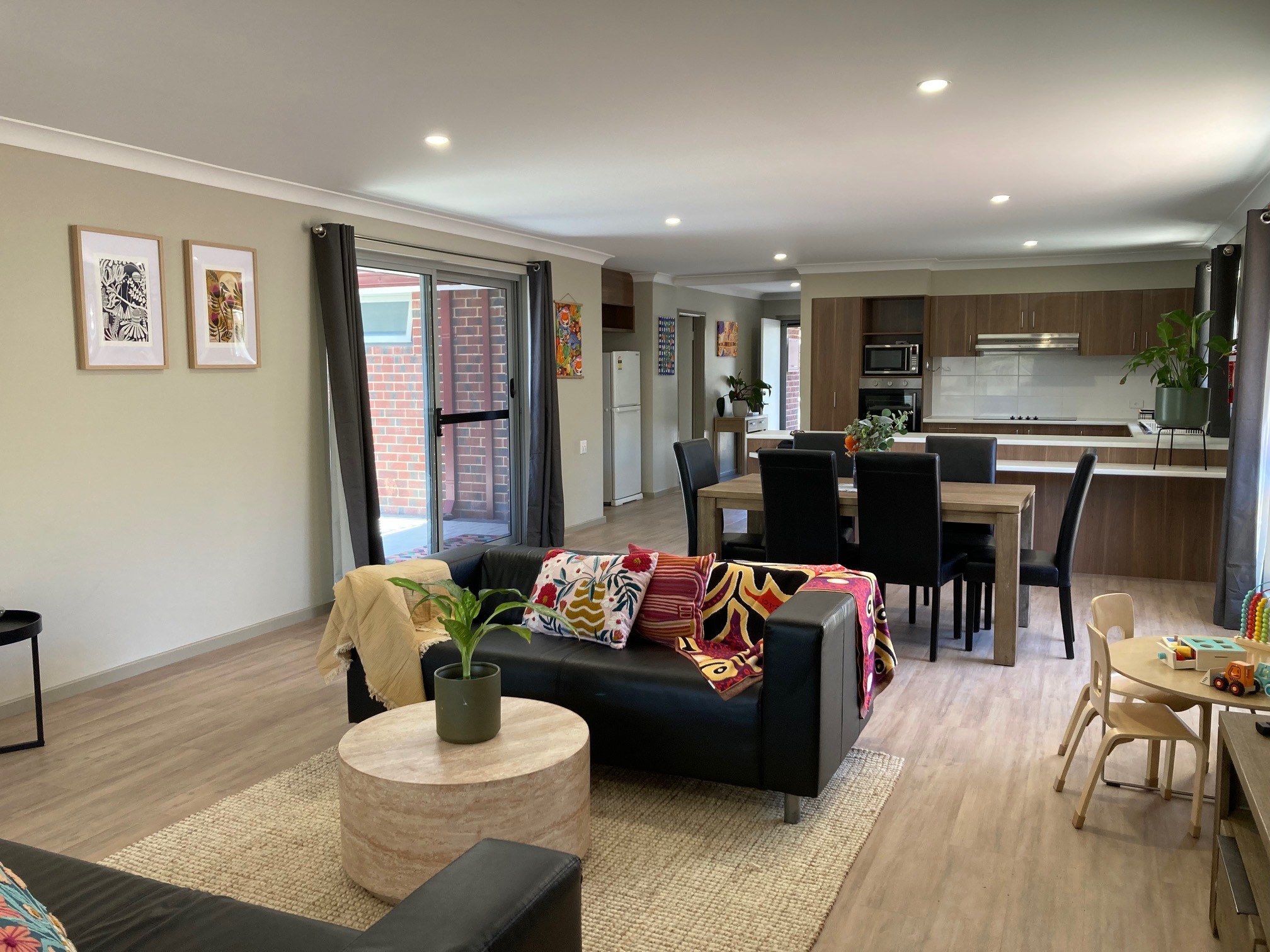 a dining and lounge area of the Bindi Bindi Mia Refuge accommodation unit