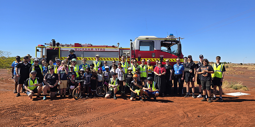 A group of people pose in front of a firetruck in rural WA as part of RSC Community Grants program