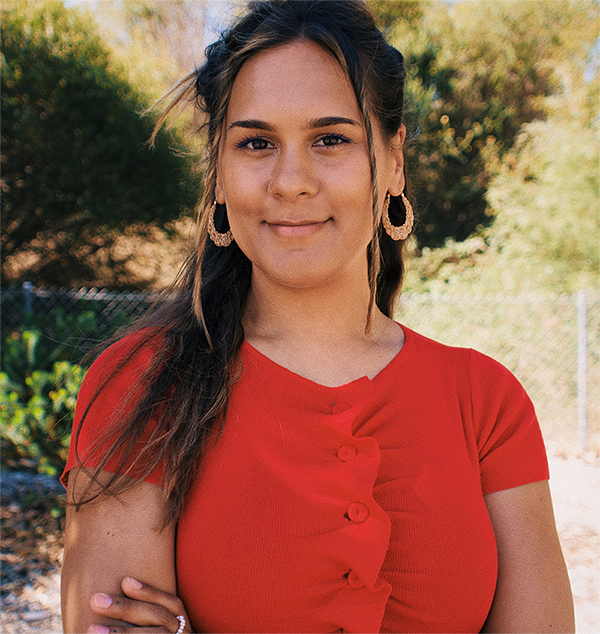 a young Aboriginal woman, smiling, confident.