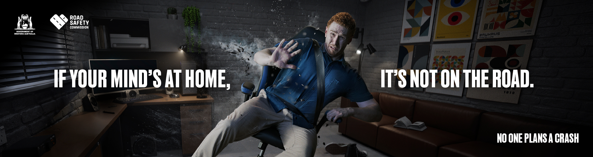 A man looks like he is sitting in his gamer den but is actually experiencing a crash. Text: If your mind's at home, it's not on the road.