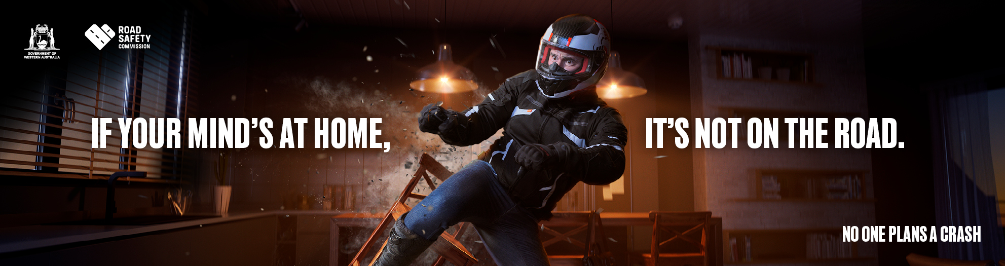 A man looks like he is in his kitchen but he's actually experiencing a motorcycle crash. Text: If your mind's at home, it's not on the road.