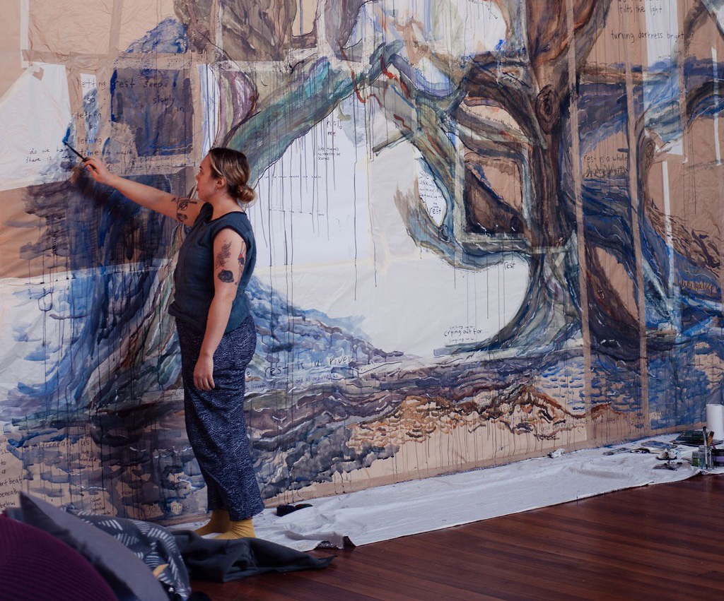 an Aboriginal woman painting