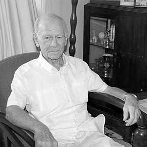 Mr Bill Grayden sitting in a chair inside a home