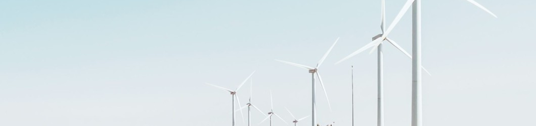Wind turbines against blue sky