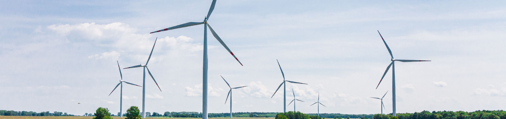 Wind turbines against blue sky