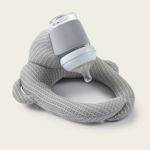 Grey self worn baby bottle self-feeding device 