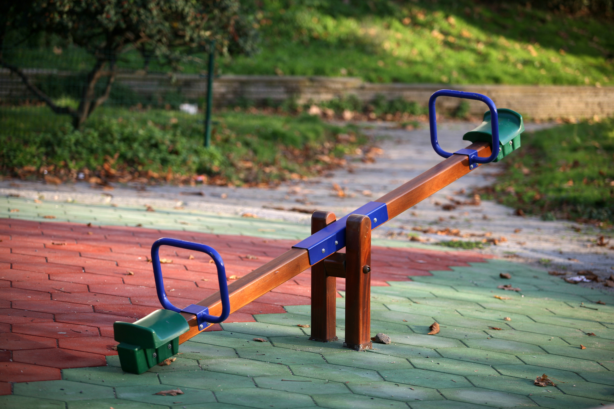 a see saw in a children's playground - no children present