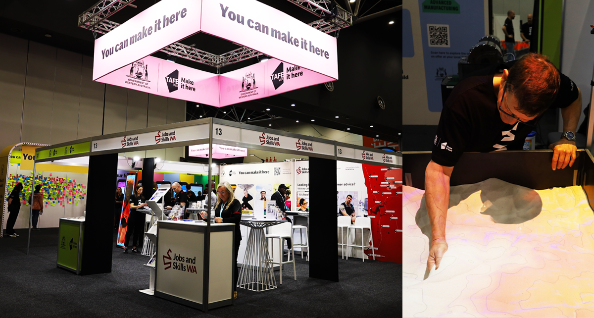 TAFE WA and Jobs and Skills WA booth at the SkillsWest Expo 2026 featuring the TAFE 'You can make it here' signage, information displays, visitors and an interactive sand-table exhibit.