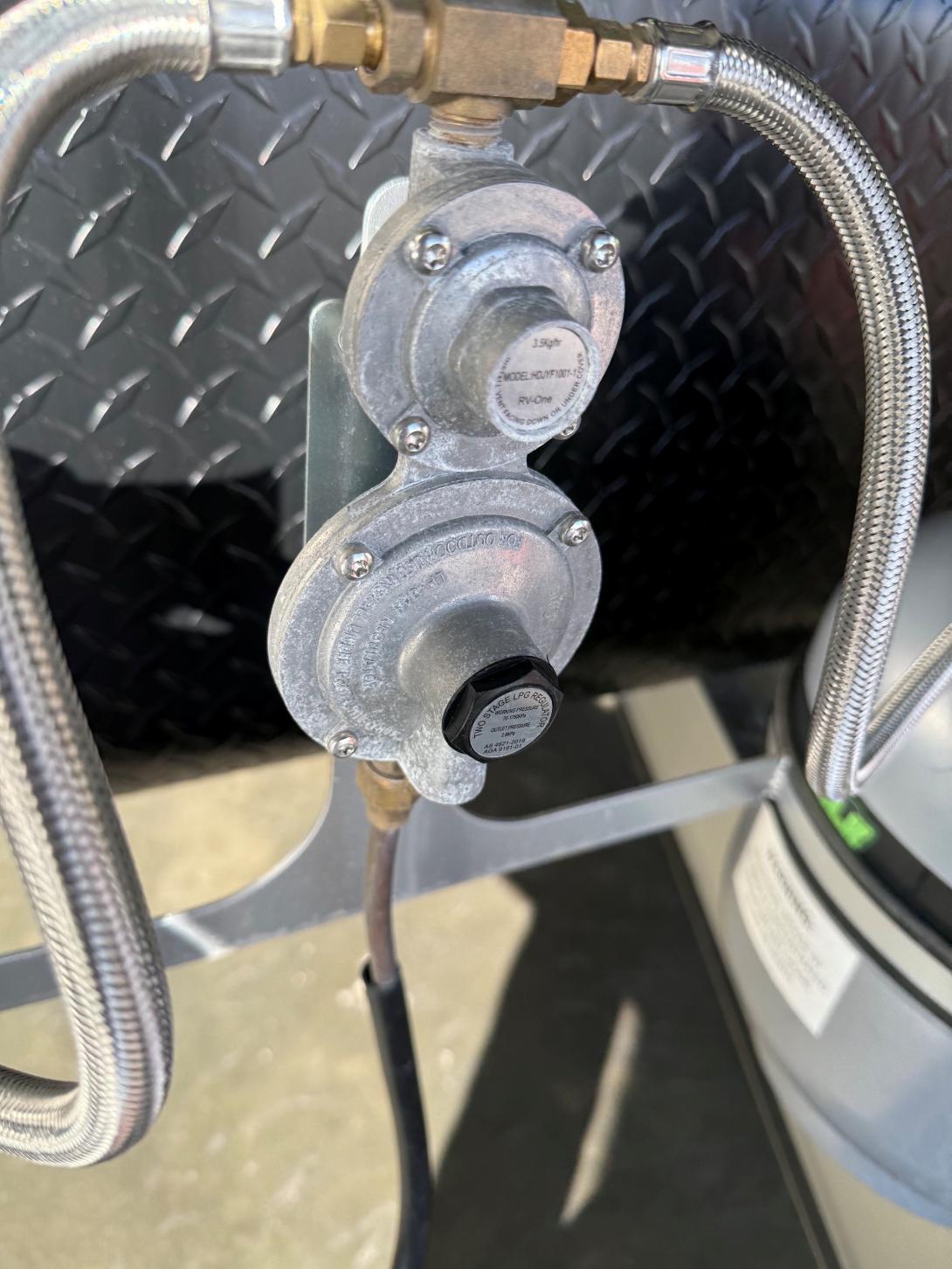 Compact metal regulator fitted to the gas system of Snowy River and Newgen caravans.