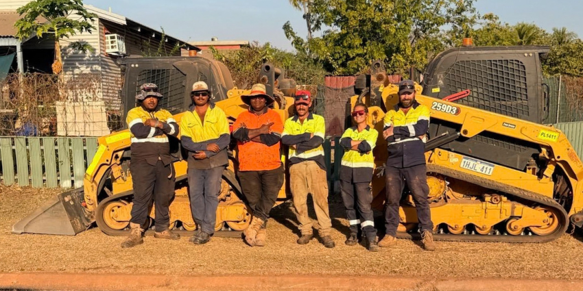Land and Field Management team members standing in front of machinery in Kalumburu.