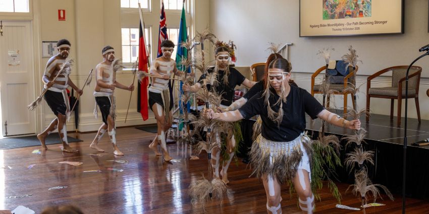 A group of dancers doing the traditional Aboriginal dance