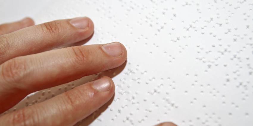 Hand reading Braille. 