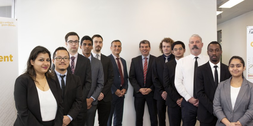 Minister Dave Kelly and Peter Bouhlas with 10 Work Integrated Learning students