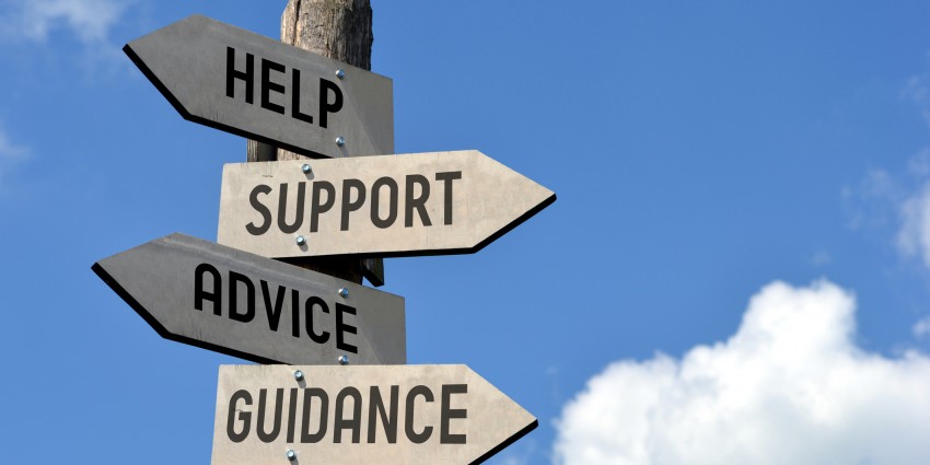 A signpost with signs pointing to help, support, advice and guidance