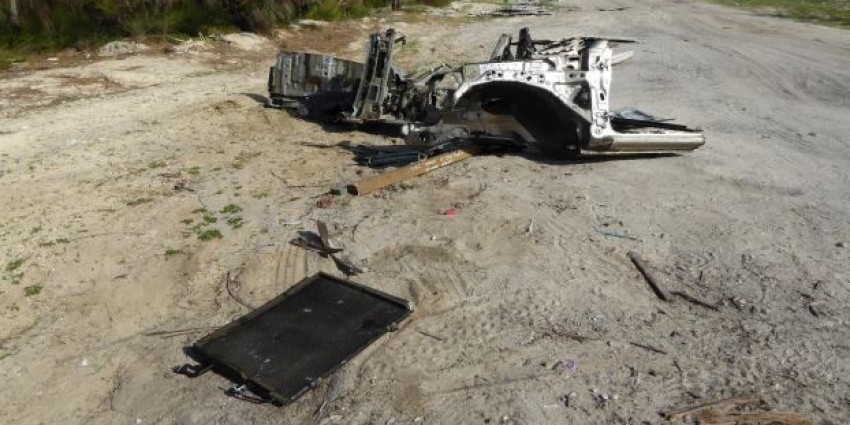 surveillance image of dumped car body