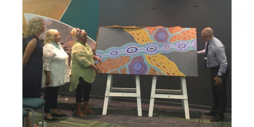people looking at aboriginal art on display