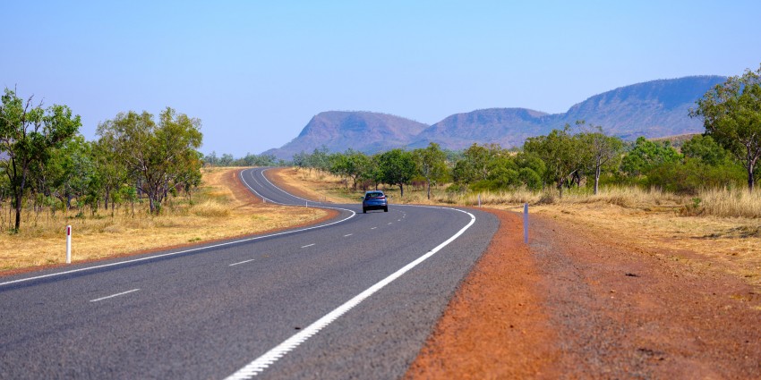 Photo of car driving along road in the Kimberley