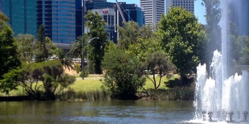 Swan river with fountain in foreground and Perth CBD in background