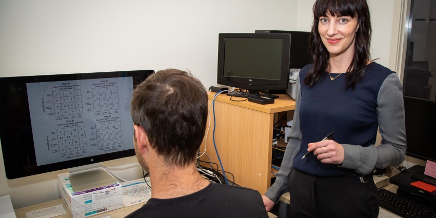 Image of DSC RHDSG recipient Chloe Smith collecting decision making data from a participant at Murdoch's Perceptual Expertise Advanced Research Lab (The PEARL). 