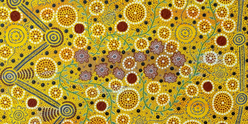 Vibrant Aboriginal painting with a yellow background.
