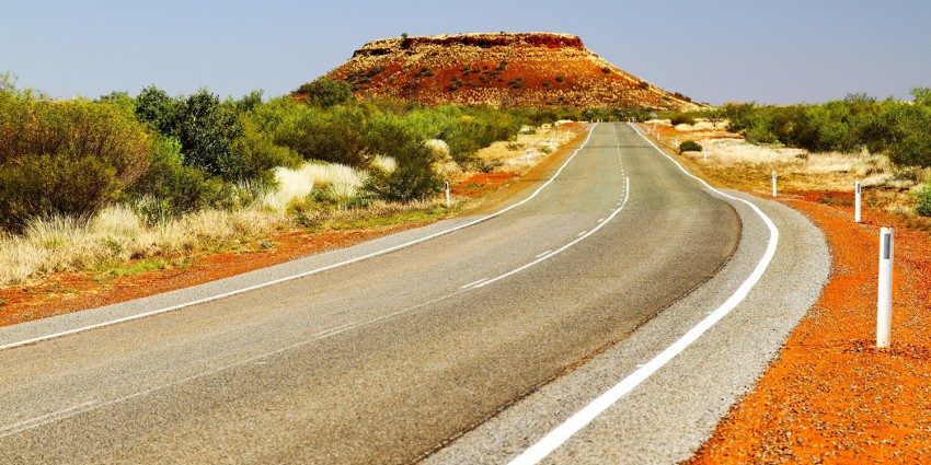 Image of a road and natural landscape in a remote location in the Pilbara