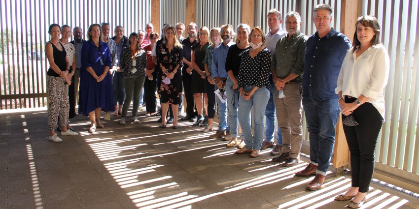 23 members of DPIRD staff standing in farm shed for photo opportunity
