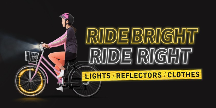 a person riding bicycle wearing a helmet with their lights on