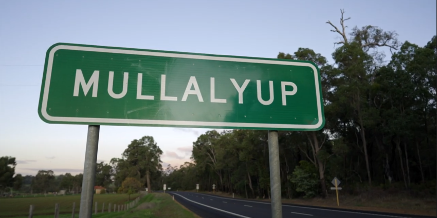 A green road sign that says 'Mullalyup'