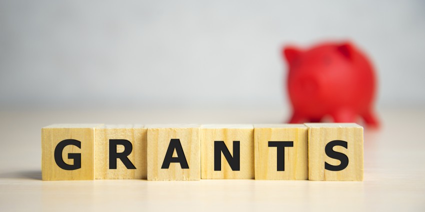 Wooden blocks spelling out the word 'grants'