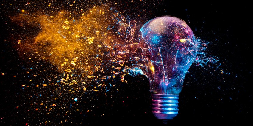 Image of light bulb and sparks representing innovation